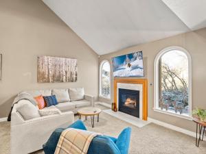 a living room with a couch and a fireplace at Alpine Base Camp Hot Tub 1Gbps pool table foosball in Cottonwood Heights