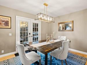 a dining room with a wooden table and chairs at Alpine Base Camp Hot Tub 1Gbps pool table foosball in Cottonwood Heights +41 photos