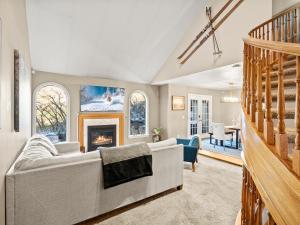 a living room with a couch and a fireplace at Alpine Base Camp Hot Tub 1Gbps pool table foosball in Cottonwood Heights