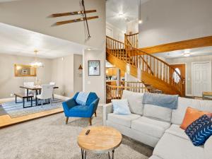 a living room with a couch and a table at Alpine Base Camp Hot Tub 1Gbps pool table foosball in Cottonwood Heights