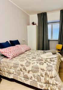 En eller flere senge i et værelse på Casa Acquarello