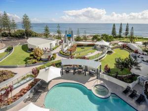an aerial view of a resort with a swimming pool at Mantra Mooloolaba Beach in Mooloolaba