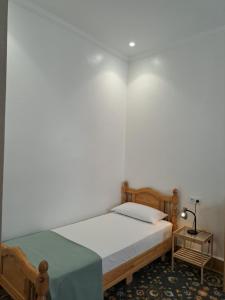 a bedroom with a large bed and a table at Central Tangier , 3xBedroom , Apartment, Historic Medina, Margarita in Tangier