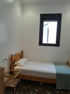 a bedroom with a bed and a window at Central Tangier , 3xBedroom , Apartment, Historic Medina, Margarita in Tangier