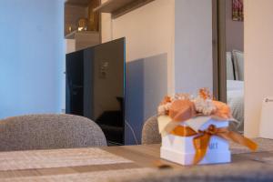 a gift box sitting on a table in front of a mirror at Elpida's Retreat, Pelion in Tsagarada +44 photos
