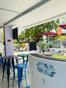 a restaurant with a table and chairs and an umbrella at Atrium Star Wars-themed Design District in Miami