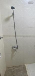 a shower stall in a bathroom with a shower at مساكن بيتي in Yanbu