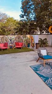 a group of chairs sitting in a park at Atrium Star Wars-themed Design District in Miami +36 photos