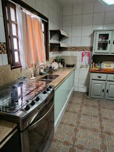 Kuchyň nebo kuchyňský kout v ubytování Casa Manacá