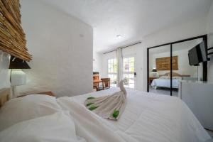 Postel nebo postele na pokoji v ubytování Hotel el kaoba