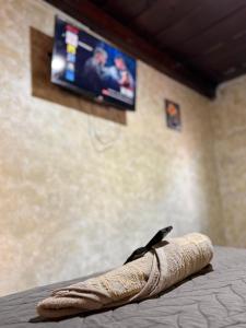 a bird sitting on the end of a breadsticks at Cristales de Antigua Hotel Cristal in Antigua Guatemala