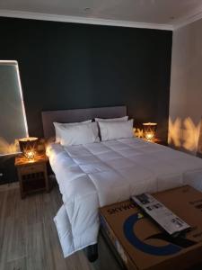 En eller flere senge i et værelse på Milino Guest House + 38 billeder