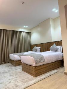 Ένα ή περισσότερα κρεβάτια σε δωμάτιο στο فندق تمايا العاشر من رمضان