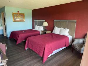 Postel nebo postele na pokoji v ubytování Mayfair Inn