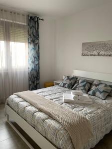 Postel nebo postele na pokoji v ubytování Casa Vacanze Anna + 14 fotografií