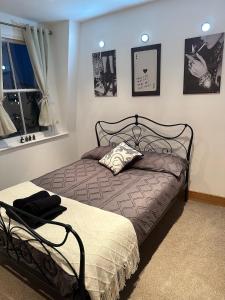 a bedroom with a bed and a window at The Imperial Beachfront Penthouse Suite in Margate