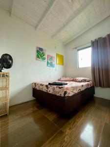 En eller flere senge i et værelse på Apartamento 2 Dormitórios Praia do Rosa