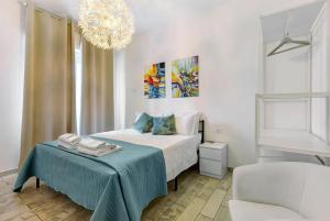 En eller flere senge i et værelse på Camere Amé Peschiera del Garda