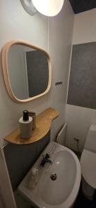 a small bathroom with a sink and a mirror at Villa Kjell in Vidsel +60 photos