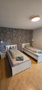 a room with two beds in a room at Villa Kjell in Vidsel