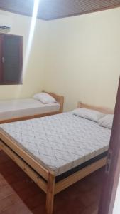 En eller flere senge i et værelse på Alojamiento céntrico