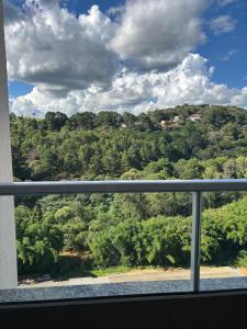 a view of a mountain from a window at Blue da Mantiqueira in Extrema