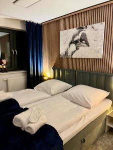 Giường trong phòng chung tại Apartament LuMi