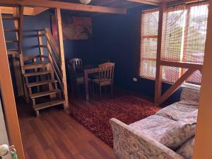 En eller flere senge i et værelse på Apart Hotel Jagui Haus Departamentos tipo Loft y Hermosa Terraza con vista al Mar