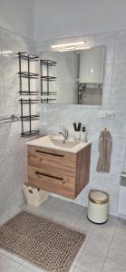 a bathroom with a sink and a toilet at Krkonošský apartmán DELUXE in Poniklá +24 photos