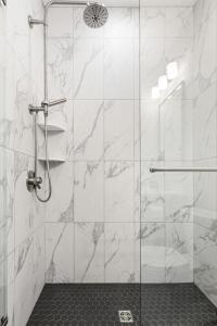 a bathroom with a shower with a glass door at Hamilton Place in Traverse City +41 photos