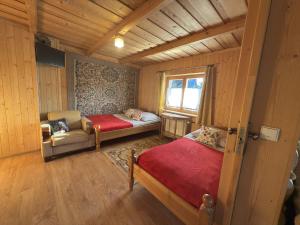a small room with two beds and a window at Zakopane - Króle 16 in Zakopane