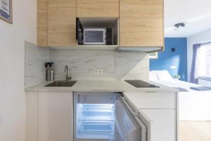 Kuchyň nebo kuchyňský kout v ubytování Apparthotel - Saint Gilles 32