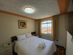 Postel nebo postele na pokoji v ubytování Hotel San Francisco INN + 17 fotografií