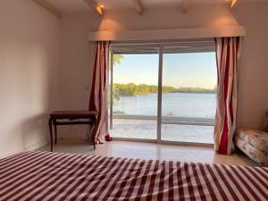 Postel nebo postele na pokoji v ubytování Casa Del Lago