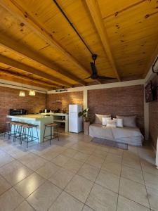 a living room with a bed and a table at Amambay in Puerto Bossetti