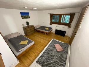 an overhead view of a room with two beds in it at Chata Dolce Donovaly in Donovaly
