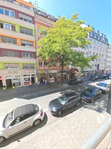 a group of cars parked on a city street at Munich Premium Guesthouse in Munich