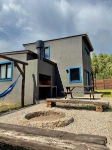 a house with a fireplace in front of it at Casa Alfonsina in Chapadmalal