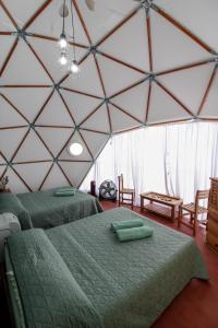 Postel nebo postele na pokoji v ubytování Aldea Hualtepec Glamping + 19 fotografií