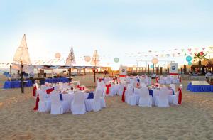 a group of tables and chairs on a beach at The Towers at Pueblo Bonito Pacifica - All Inclusive - Adults Only in Cabo San Lucas +72 photos