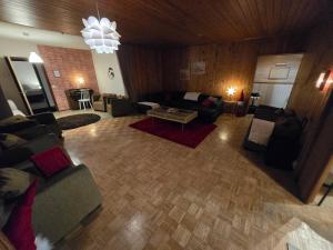 an overhead view of a living room with a couch and a table at Patomajat in Rovaniemi