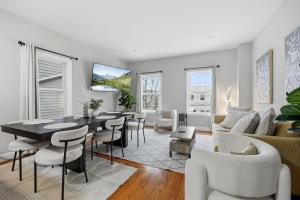 a living room with a table and chairs at 3 BR • Full Kitchen • Sleeps 8 in Jersey City