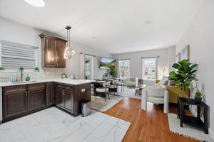 a kitchen and living room with a living room and a dining room at 3 BR • Full Kitchen • Sleeps 8 in Jersey City
