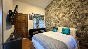 En eller flere senge i et værelse på Casa La Patrona