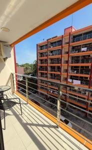 een balkon met uitzicht op een gebouw bij Bright Sun Apartment with Pools in Rawai Beach