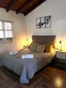 En eller flere senge i et værelse på Tacuifi I - Apartamentos + 35 billeder