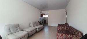 a living room with couches and a couch at Hotel Cartagena antigua in Cartagena de Indias