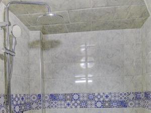 a shower with a glass door in a bathroom at Belle Maison Taghazout in Taghazout +20 photos
