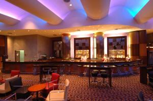 a bar in the lobby of a hotel at Royal Dead Sea - Hotel & Spa in Ein Bokek