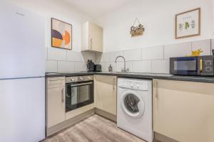 Η κουζίνα ή μικρή κουζίνα στο Stylish Studio Apartment